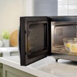 clean microwave with a microwave-safe bowl of lemon water