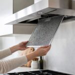 modern range hood with a removable stainless mesh grease filter